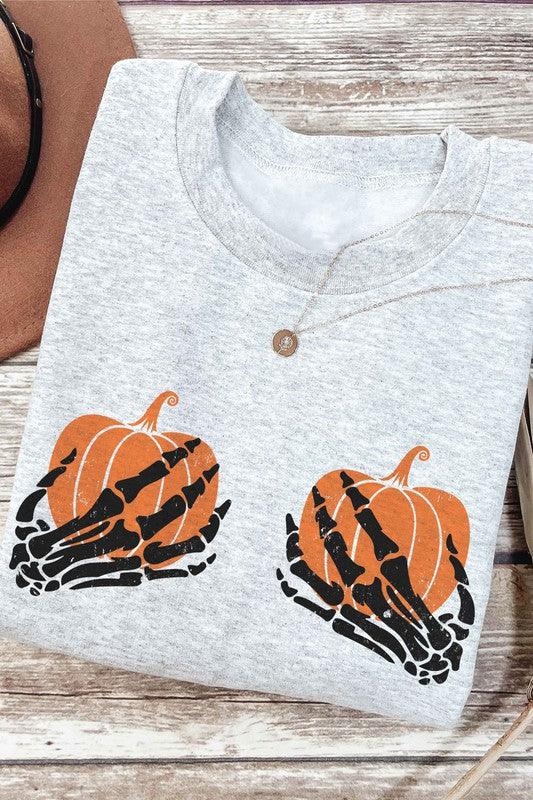 SKELETON HOLDING PUMPKINS Graphic Sweatshirt